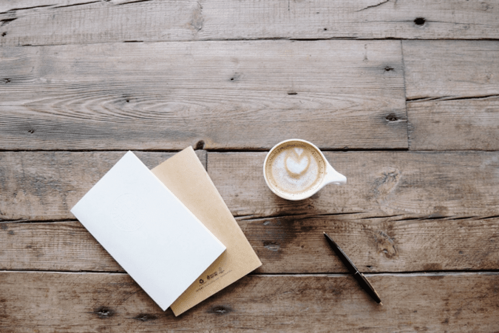 A Cup of Coffee, Pen and Notes on the Desk