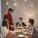 A group of people sharing a meal, representing connection, belonging, and meaningful social interaction.