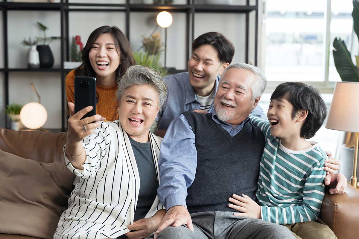 Asian family taking a group selfie