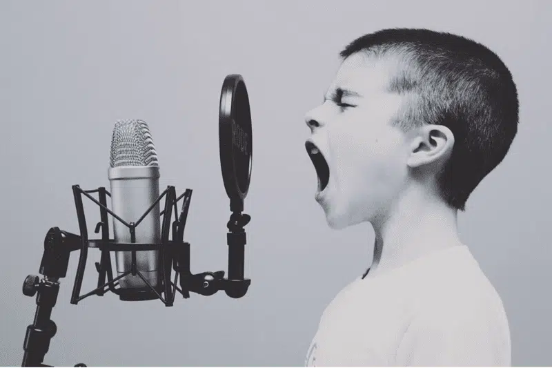 A Kid Singing in a Music Studio