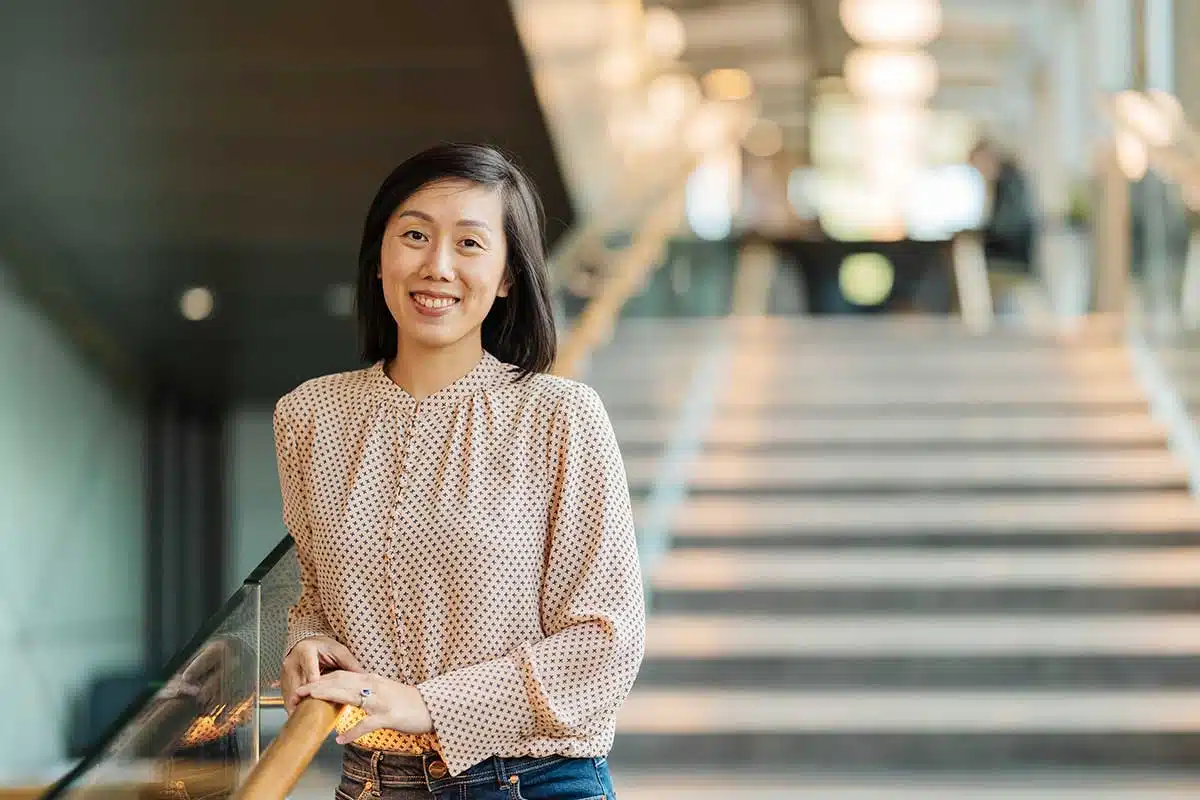 Portrait of Dr. Magdalene Chang smiling gently, calm expression conveying warmth, trust, and professional presence