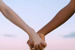 Two people holding hands, connection and intimacy, relationship support, couples therapy Singapore guidance
