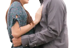 Asian couple smiling at each other, holding hands, showing connection, love, relationship counselling Singapore
