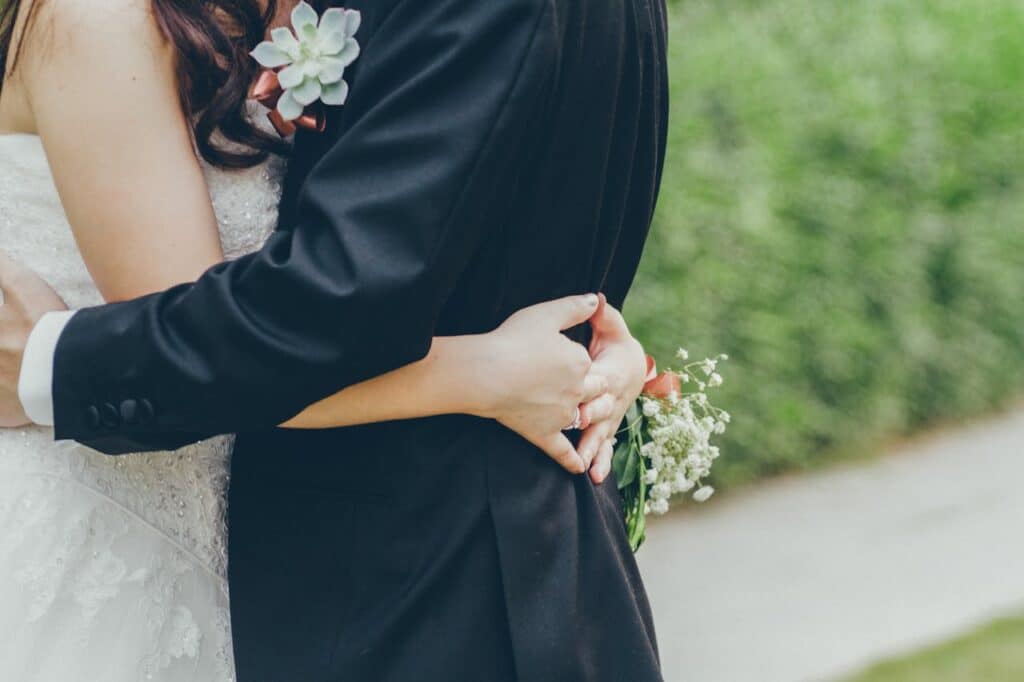 Bride and groom embracing outdoors, representing love, trust, and relationship counseling