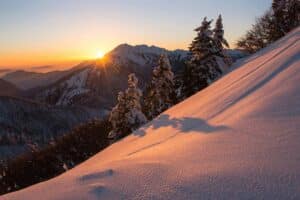 Snowy mountain peak at sunrise symbolizing clarity, perspective, and the human journey toward meaning and purpose