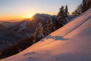 Snowy mountain peak at sunrise symbolizing clarity, perspective, and the human journey toward meaning and purpose