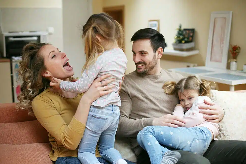 A happy family enjoying fun time together in the living room