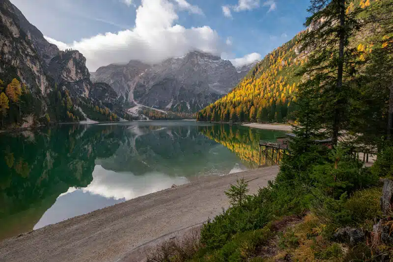 a lake surrounded by mountains and trees